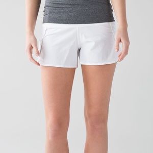 White Lululemon run times shorts
